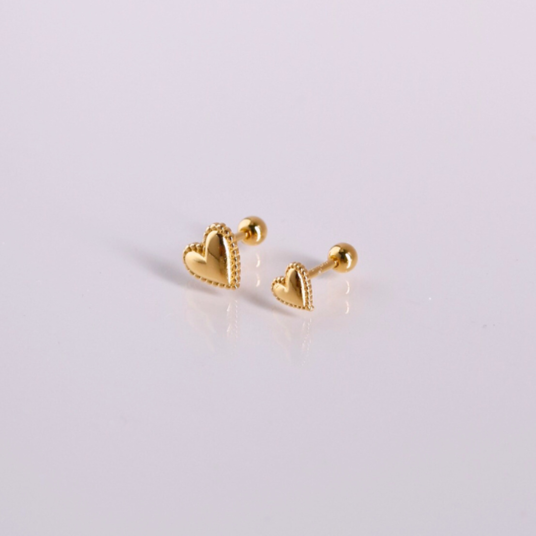 Golden heartbeat piercing