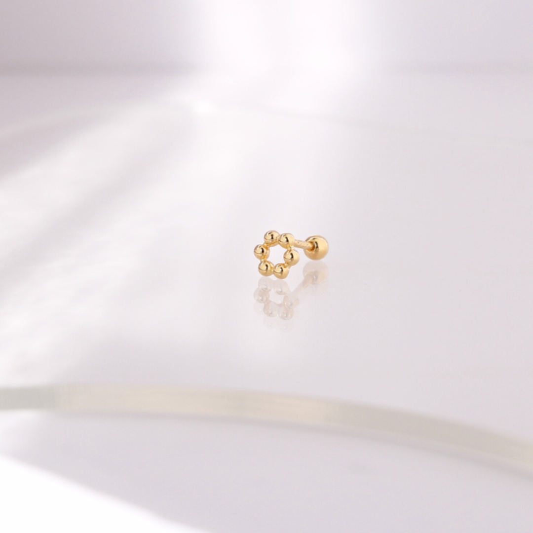 Golden bloom piercing