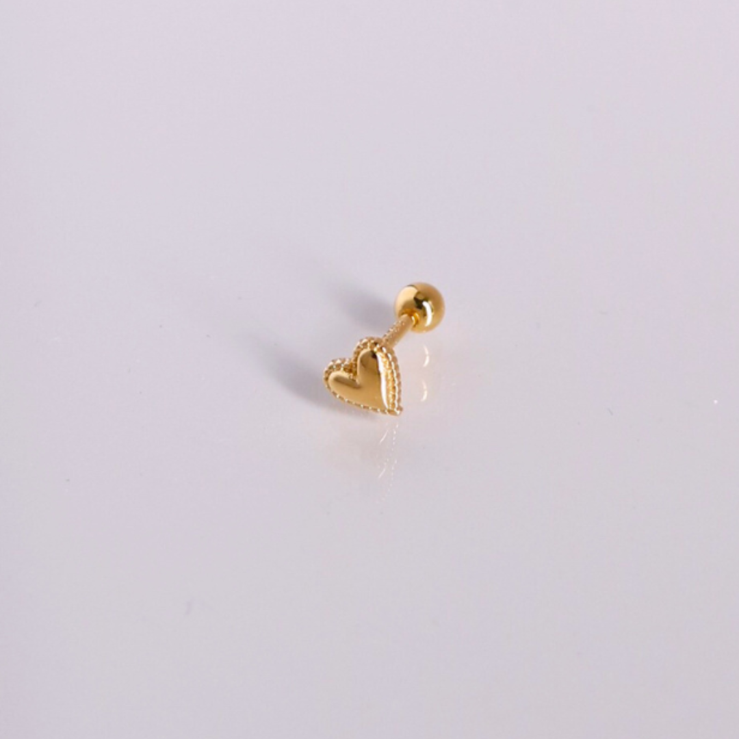 Golden heartbeat piercing