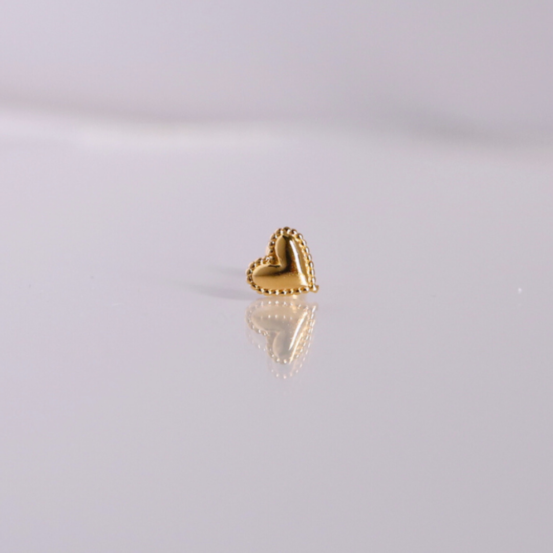 Golden heartbeat piercing