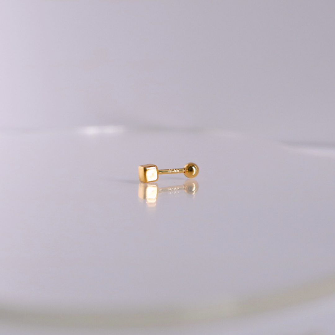 Golden cube piercing