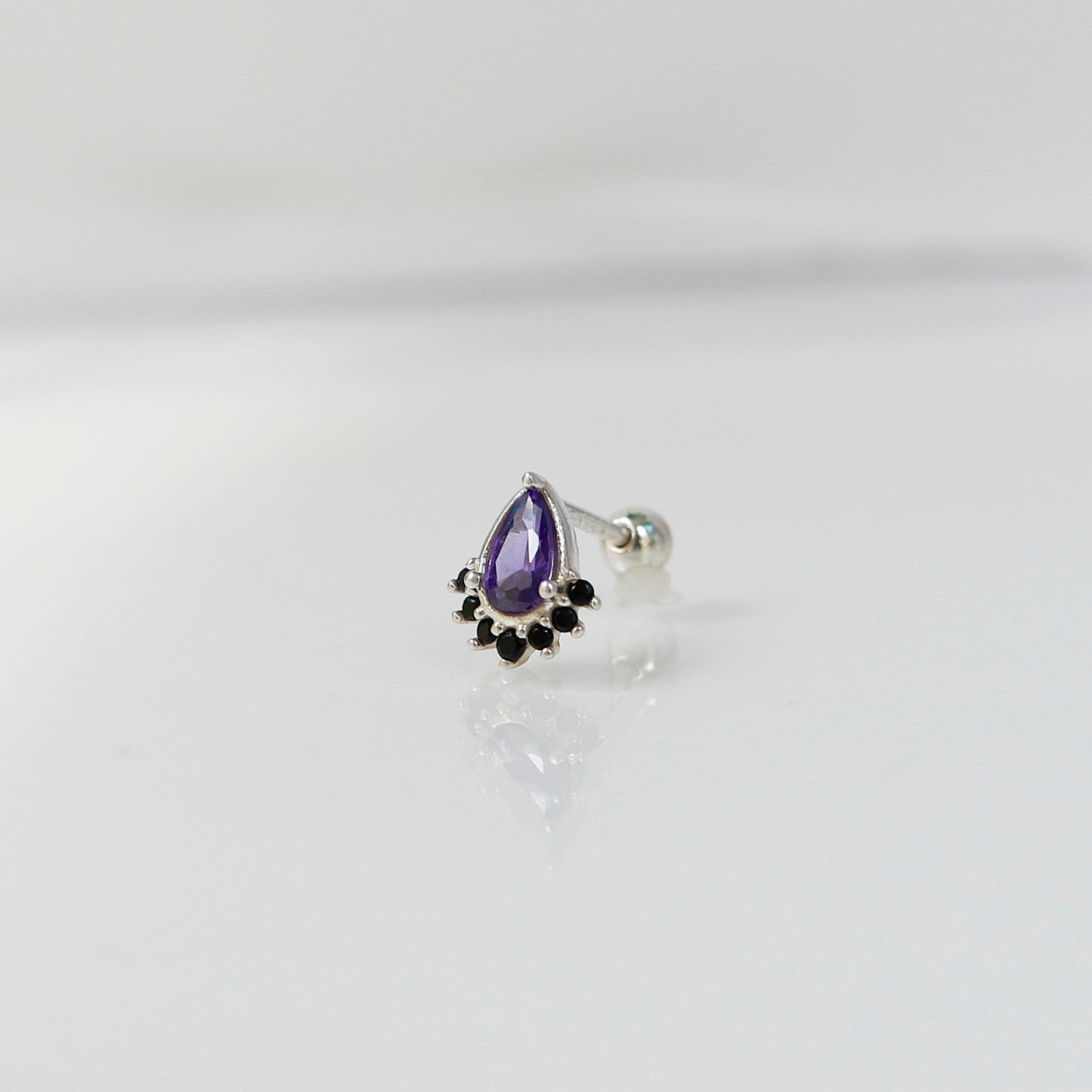 Dreamscape teardrop piercing