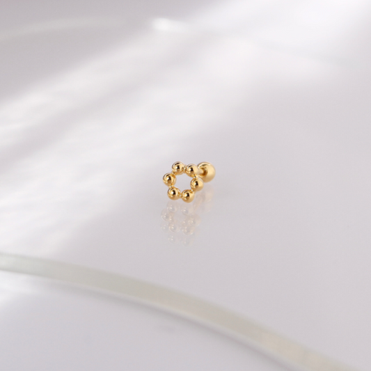 Golden bloom piercing
