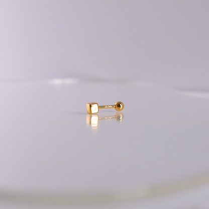 Golden cube piercing