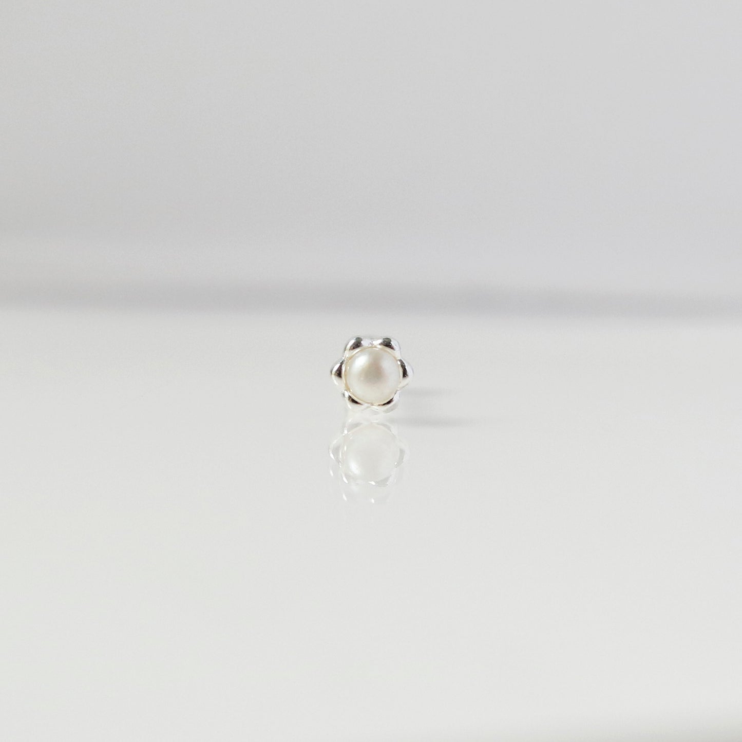 Blossom pearl piercing
