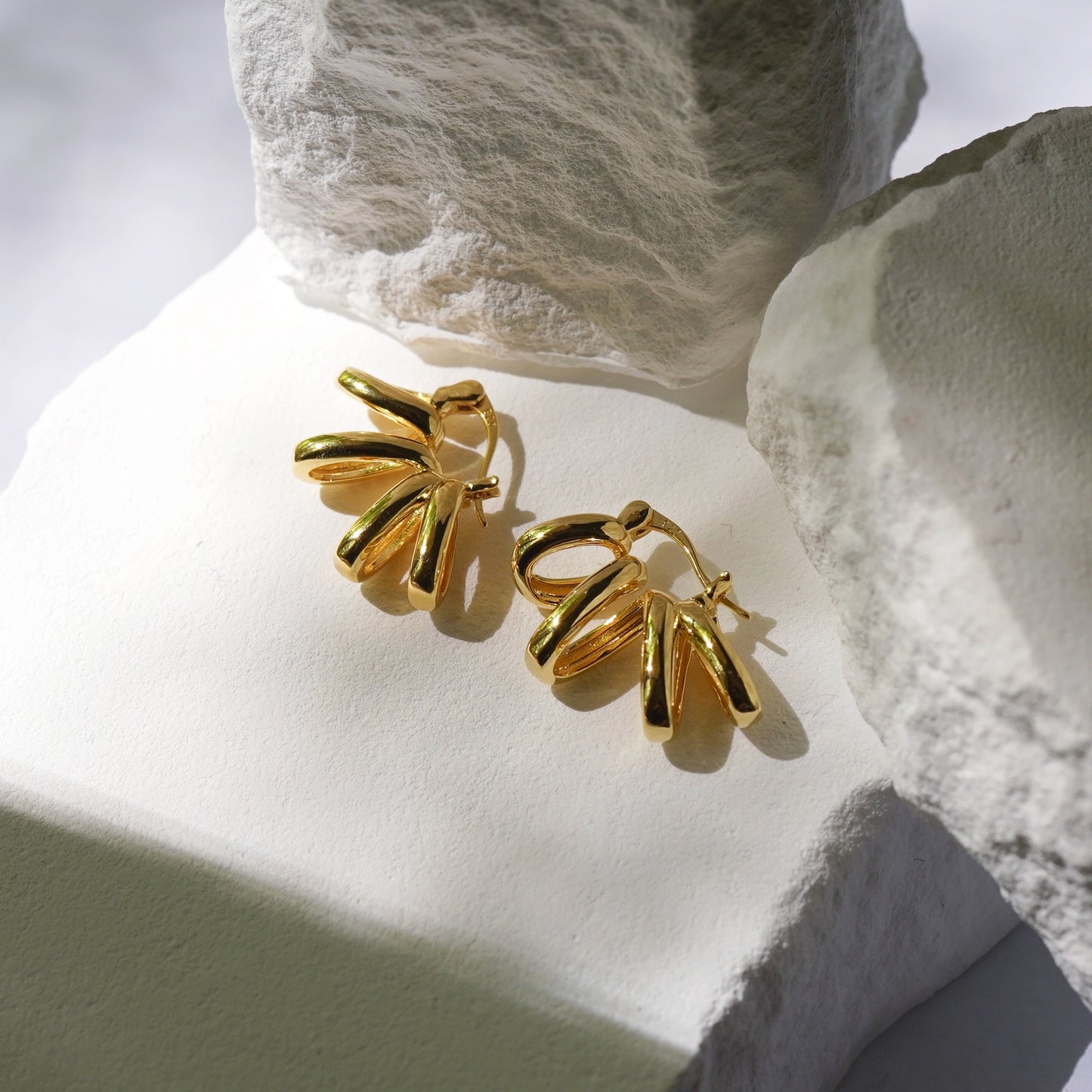 Gold sunburst earrings
