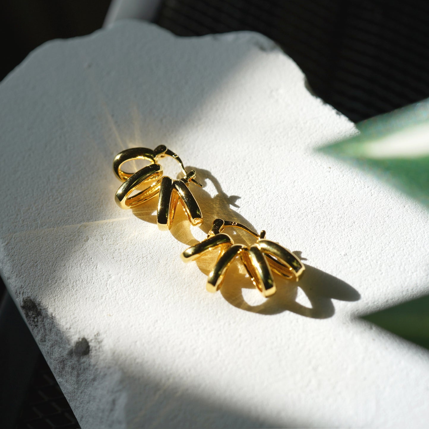 Gold sunburst earrings